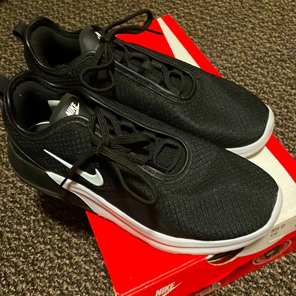 Black and white Nike shoes, size 8